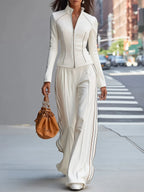 Conjunto de pantalones de pierna ancha con cuello alto y cremallera blanco