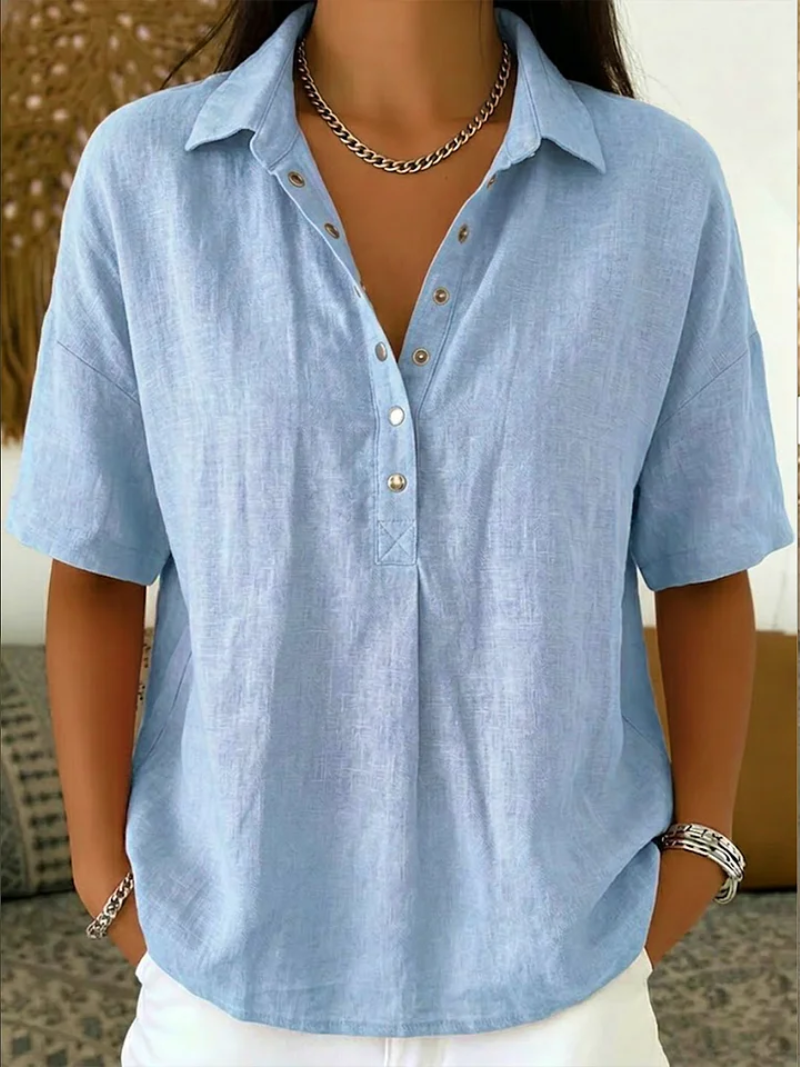 Carlota blusa elegante con botones azul claro