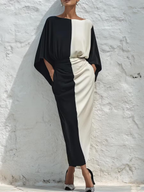 Two-piece set with a contrasting white and black top and midi skirt
